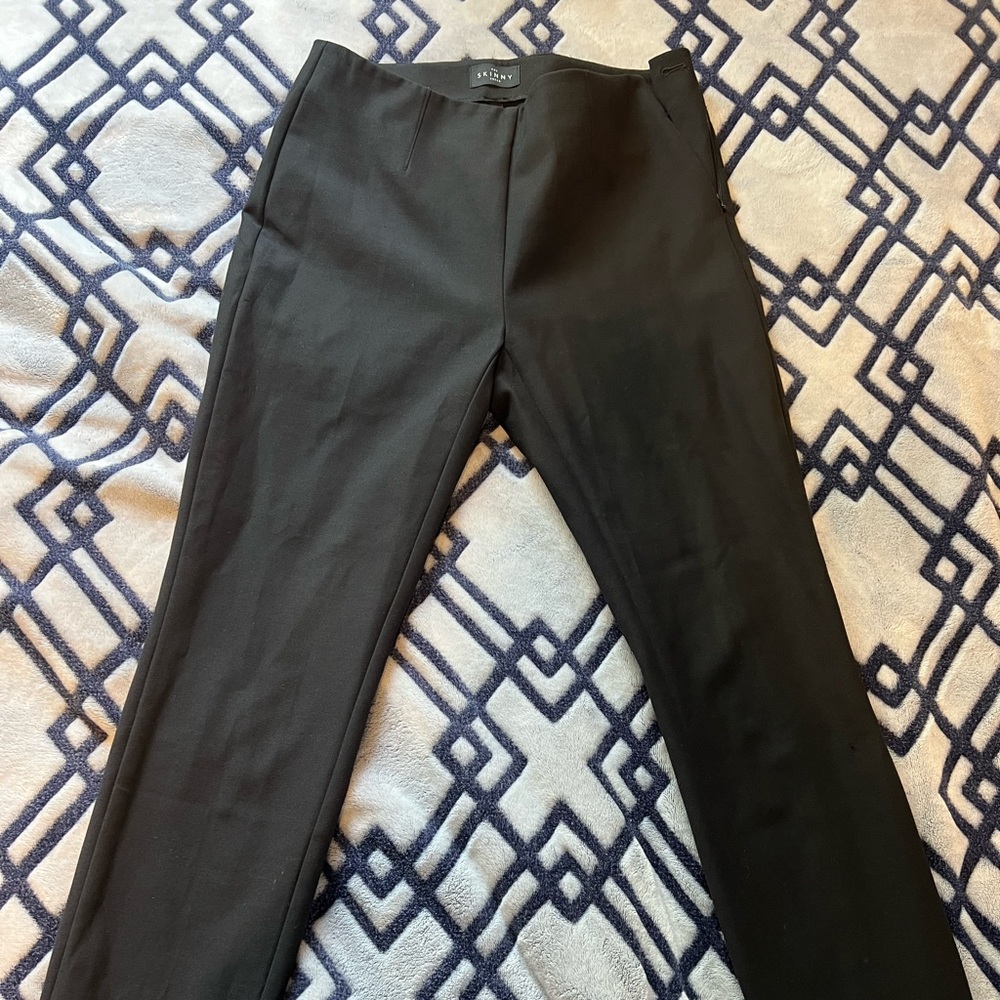 Skinny black dress pants.